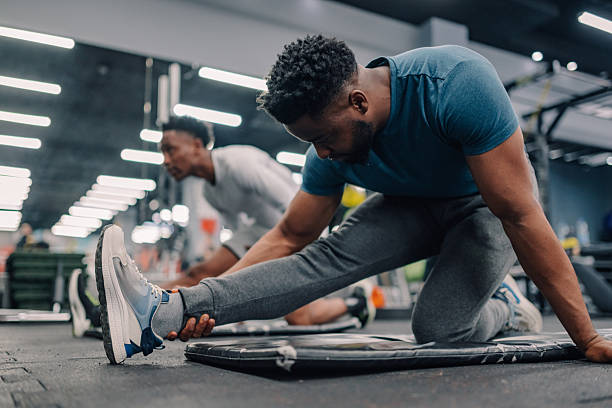 Exhausted athlete working out in gym