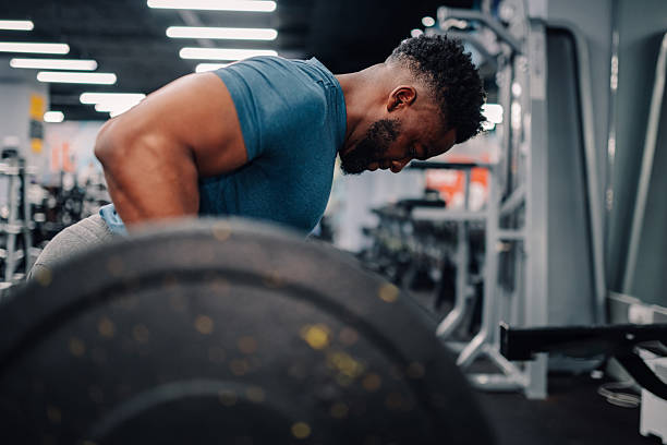istock Determined bodybuilder lifting weights in gym for muscle growth 2218966887