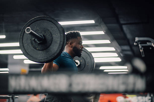 istock Determined athlete lifting weights in gym, building strength and power 2218966901