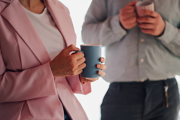 istock Business people holding mugs during coffee break 2218967311