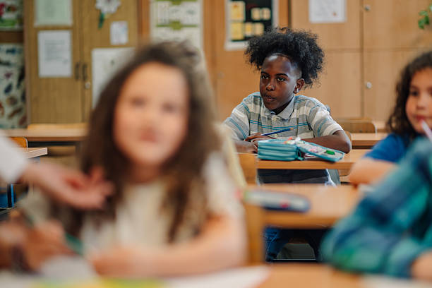 istock Elementary school student listening attentively in classroom 2218967454
