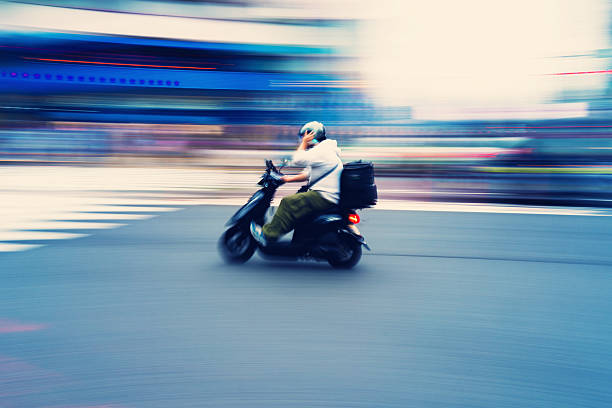 istock Scooter Courier on the Move in Shibuya, Tokyo 2218970225