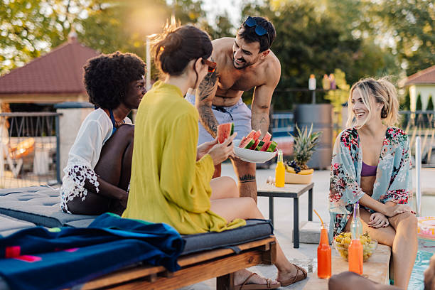 istock Friends enjoying a relaxing poolside gathering 2218970393