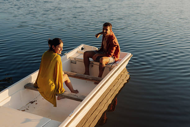 istock Young adults enjoying a serene boat ride 2218970430