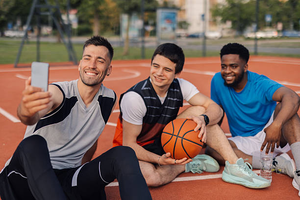 istock Basketball players taking selfie after training session 2218970808