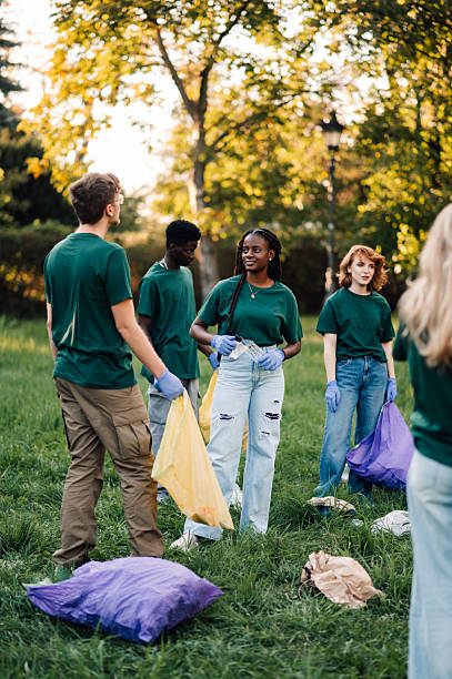 istock Volunteers collecting garbage in a public park 2218970874
