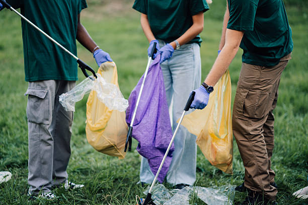 istock Volunteers collecting garbage in a public park 2218970876