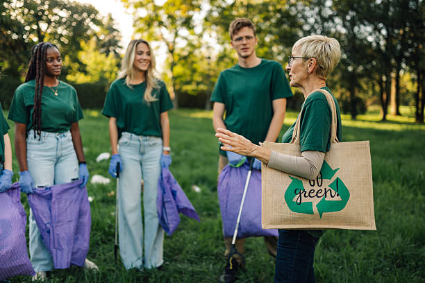 istock Volunteers picking up trash in a public park during a community cleanup event 2218970936