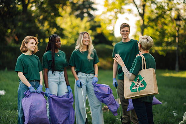 istock Volunteers collecting garbage in park during community cleanup 2218970943
