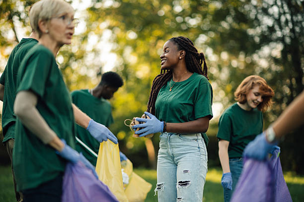 istock Volunteers collecting trash in park during community cleanup 2218970986
