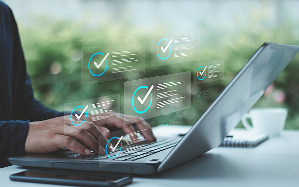 istock Business evaluation and performance tracking in cyberspace using online checklist survey assessment platform quality assurance technology digital form and review process. Businessman typing on laptop. 2218973858