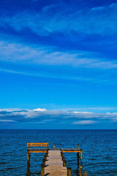 istock Dramatic blue sky and clouds over Chesapeake Bay and fishing pier 2218975385