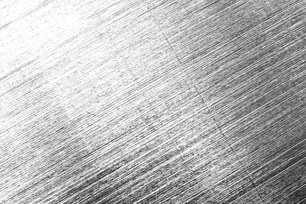 micro photography, extreme close up scratched metal surface texture