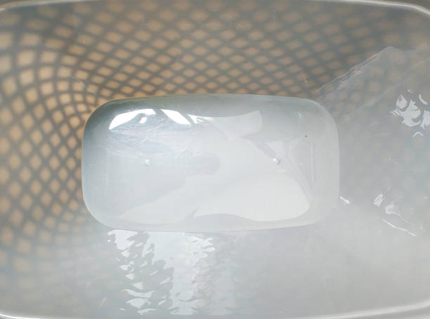 Abstract image of a translucent soap bar in water, highlighting cleanliness and purity. Evokes a sense of minimalism and calm. Ideal for hygiene, health, or wellness themes.