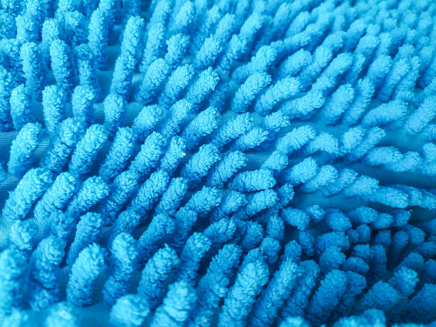 istock Abstract closeup of a textured blue microfiber cloth or mat. Soft, absorbent material for cleaning, bath, or home decor. Illustrates comfort, hygiene, and cleanliness. 2218979100