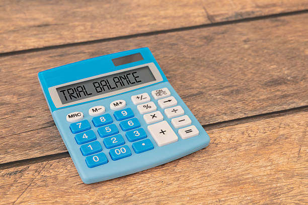 istock trial balance text on yellow sticky note on yellow notepad near coffee cup. 2218979431