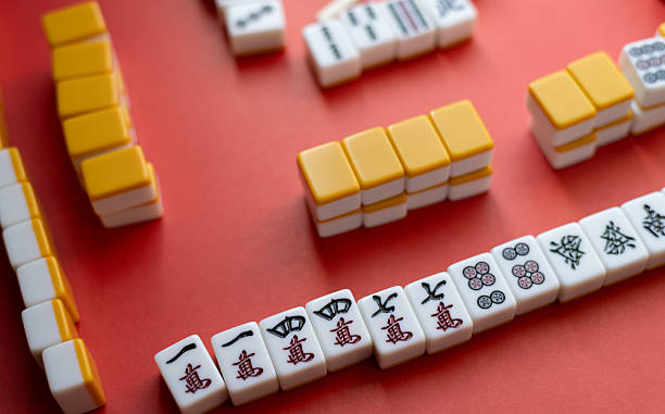 istock Mahjong tiles lined up on a red background 2218983501