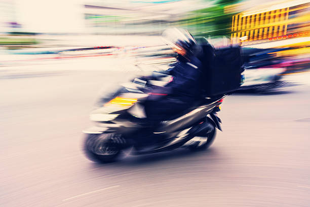 istock Scooter Courier on the Move in Tokyo 2218985052