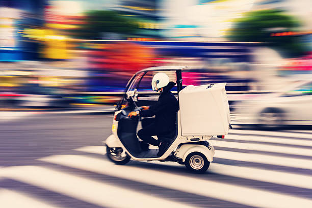 istock Three-wheeled delivery scooter at Shibuya crossing 2218985077
