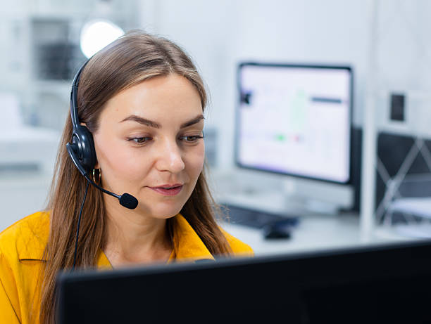 istock Woman Customer support, call center with headset working in office, consulting client, talking online, support service looking at computer screen at desk. 2218989586