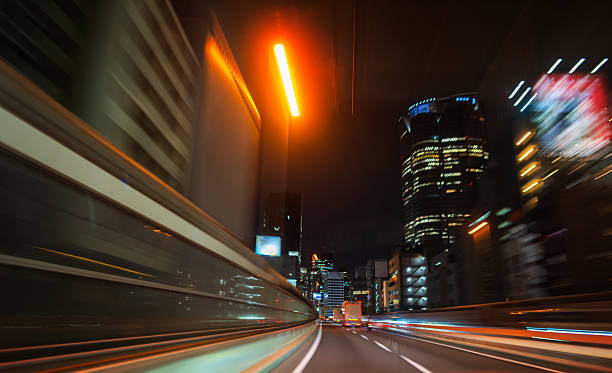 istock Urban Expressway with Red Glow and Skyscrapers at Night 2218989937