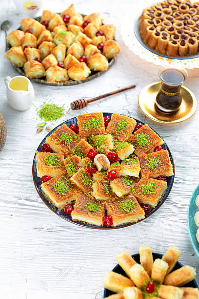 istock Cream basbousa, white background, light Middle Eastern hospitality dessert. 2218996134