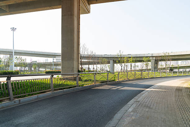 istock Concrete structure and asphalt road space under the overpass in the city 2219001715