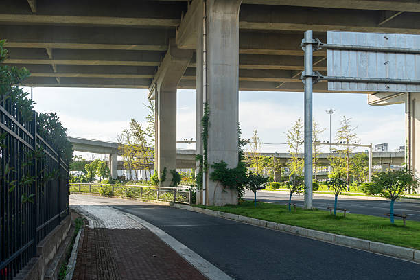 istock Concrete structure and asphalt road space under the overpass in the city 2219001840