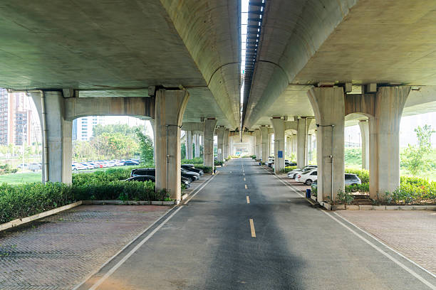 istock Concrete structure and asphalt road space under the overpass in the city 2219001880