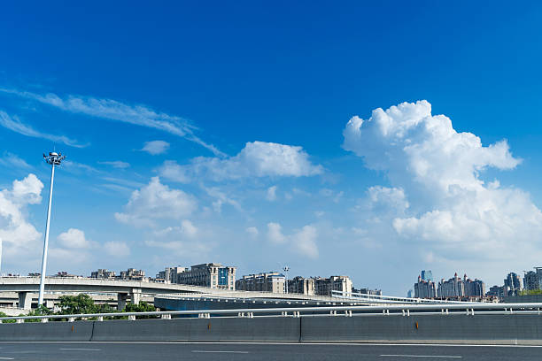 Highway overpass modern city skyline background
