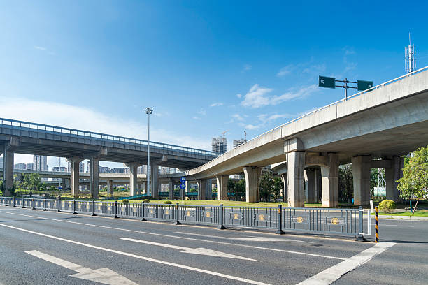 istock Concrete structure and asphalt road space under the overpass in the city 2219002239