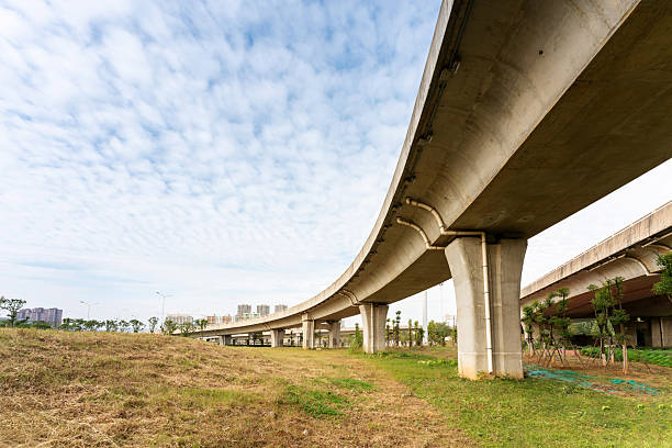 istock Concrete structure and asphalt road space under the overpass in the city 2219002461