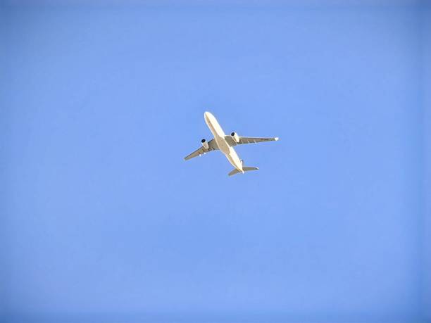istock a plane is flying high in the air. 2219003067