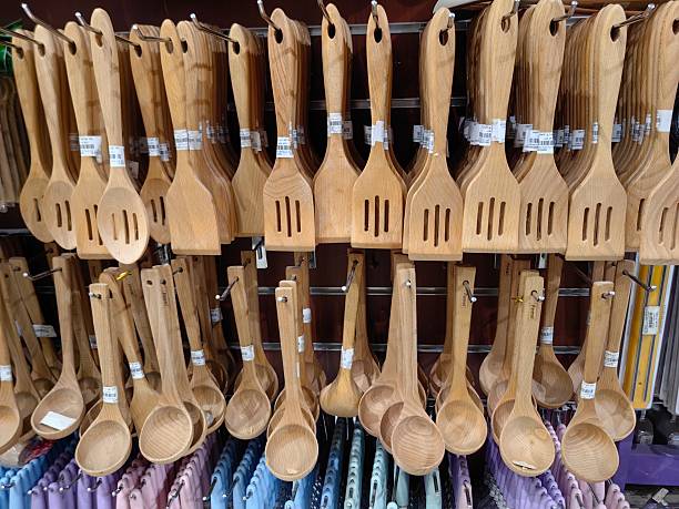 Wooden spatula, wooden flat spatula set hanging on kitchen section supermarket.