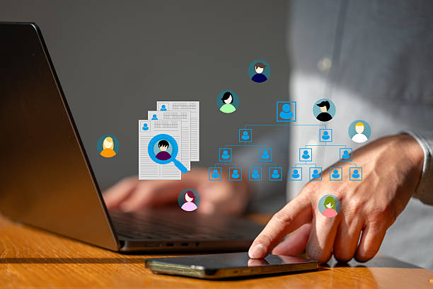 istock Business man  work with smartphone to seek data  to find a human data which are floating on screen 2219008326