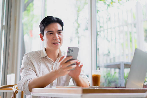 istock Enjoying a relaxing afternoon while using a smartphone in a cozy cafe setting 2219011839
