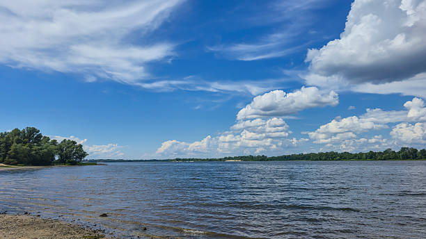istock River surrounded by trees. Camping Volumetric clouds. Outdoor recreation. 2219012341