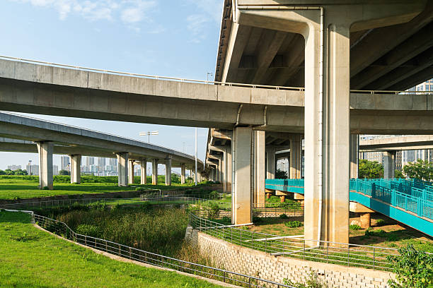 istock Concrete structure and asphalt road space under the overpass in the city 2219015006