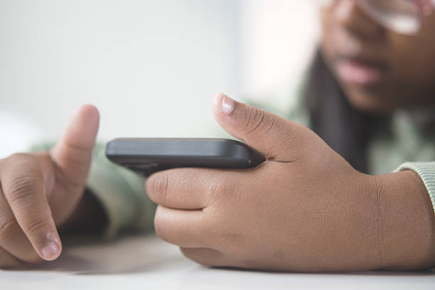 istock Child Holding Smartphone in Hands for Online Activities 2219015085