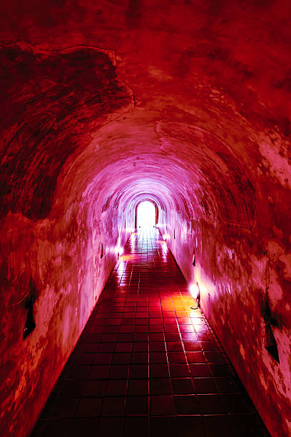 Chiang Mai Series : An ancient tunnel of a temple. An old tunnel with a skylight. Old building with light streaming through. Historic tunnels in northern Thailand. Wat Umong.