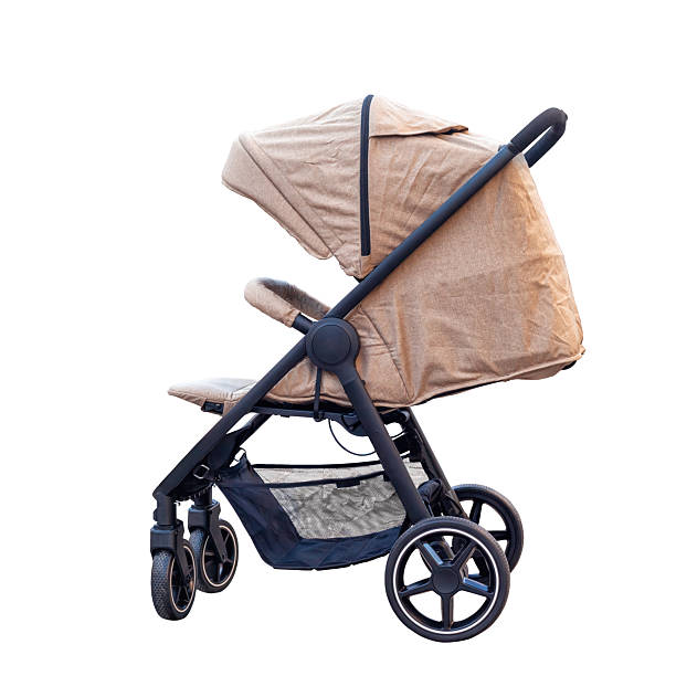 Asian baby boy sleeping in stroller on nature park.