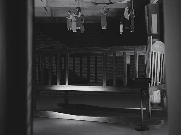A classic wooden fence in black and white photography.