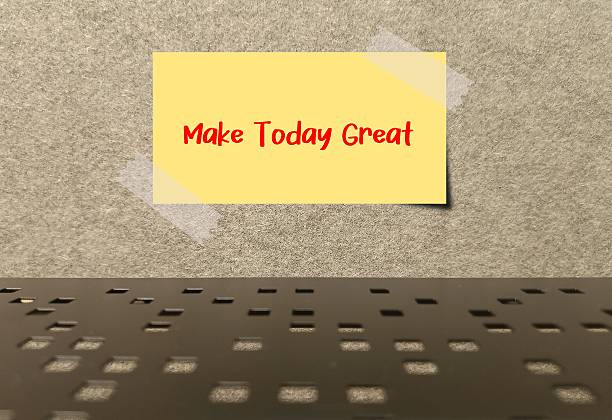 Stick note on wallpaper with affirmation written MAKE TODAY GREAT to remind oneself to cultivate a day filled with positive experiences and a sense of accomplishment