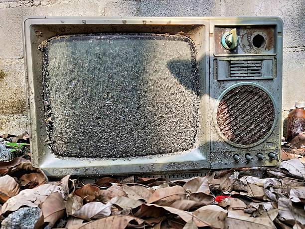 Old vintage TV set from 1980s, 1990s, 2000s with noise and interference on the screen isolated on white background.