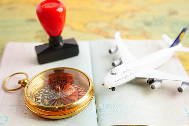 istock Passport with airplane and flag on white background with copy space. 2219025493