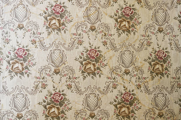 istock Old wallpaper on the wall. Old wallpaper for texture or background. 2219027922