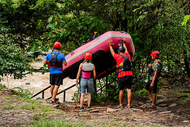 istock Friends carying a inflating raft outdoors 2219029990