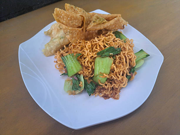 istock Mi Goreng Or Fried Noodle With Pangsit Goreng Or Fried Dumpling, Mustard. Food Menu. 2219034353