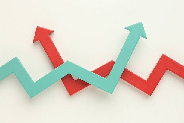 istock Multicoloured arrows pointing up and down. Symbolise growth progress, success in business finance. Rising bars of graphs represent market trends, return on investment, business development, financial graphs. 2219036464