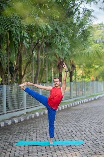 istock Balancing Yoga Pose in Natural Surroundings 2219038975